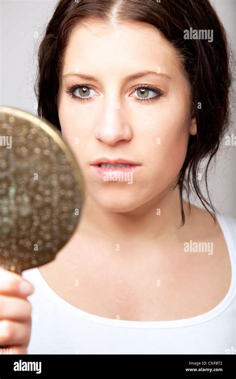 Woman Looking At Herself In A Mirror Hi Res Stock Photography And