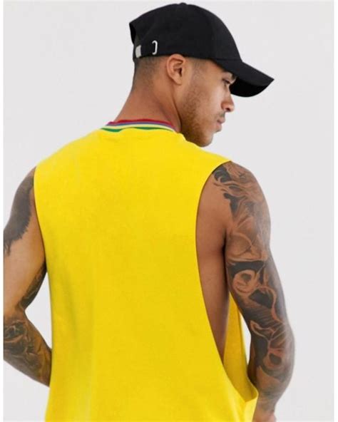 Asos Relaxed Sleeveless T Shirt With Extreme Dropped Armhole And Tipping In Yellow In Yellow For