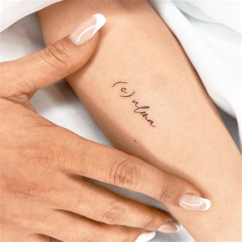 C Alma Lettering Tattoo Located On The Inner