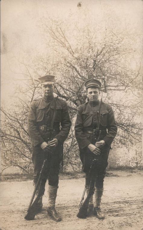 Two Soldiers Posing on a road World War I Postcard