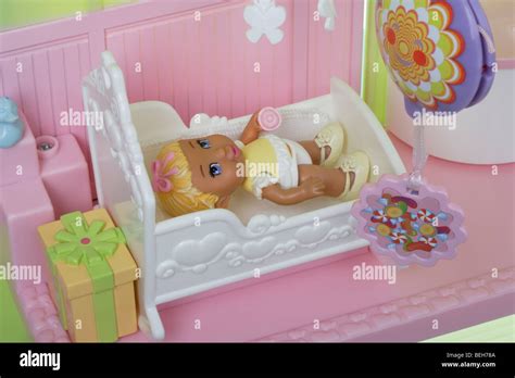 Baby Girl Doll In Her Cot Stock Photo Alamy