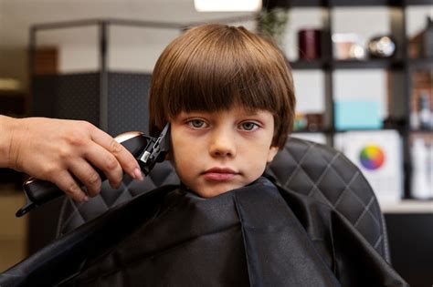 Free Photo Kid Getting Haircut At Salon Front View