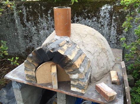 An Outdoor Pizza Oven Made Out Of Stone