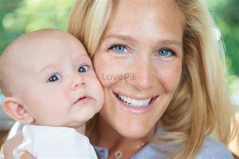 Smiling Mother Holding Baby Picture And Hd Photos Free Download On