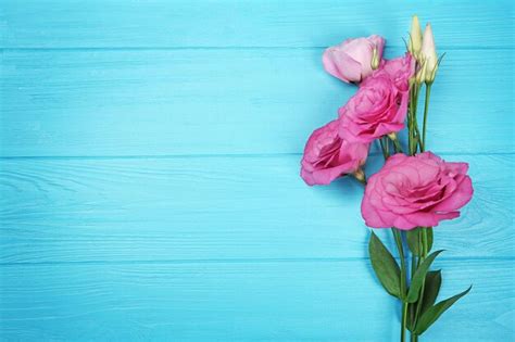 Premium Photo Fresh Flowers On Turquoise Wooden Background