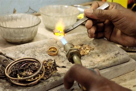 Premium Photo Goldsmith Working With A Unfinished Ring