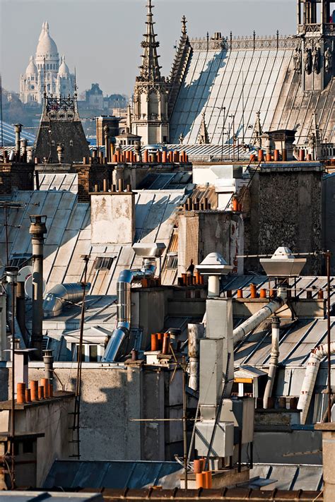 Photothèque Arnaud Frich Les toits de Paris et la basilique du Sacré