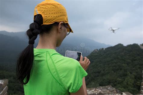 Woman Flying Drone Taking Photo Stock Image - Image of eastern, drone: 105501889