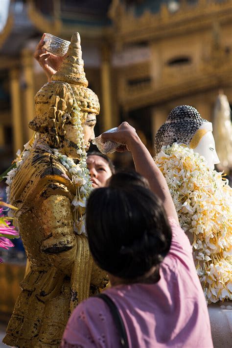 People Pouring Water Over A Buddha License Image 71162369 Image