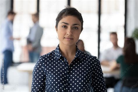 Headshot Portrait Of Happy Successful Young Indian Female Employee