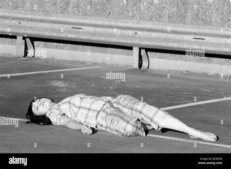 Playing dead woman hi-res stock photography and images - Alamy