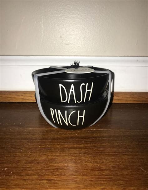 Two Black Dishes With The Words Dash And Pinch Written On Them