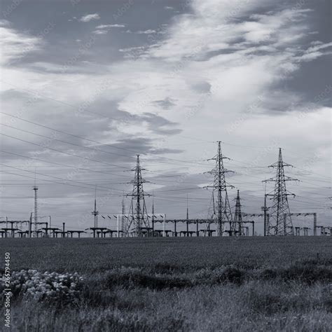 Power Lines And Sky With Clouds High Voltage Power Lines Field And