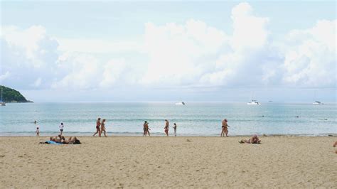 PHUKET THAILAND NOVEMBER 11 2018 Tourists On The Nai Harn Beach One