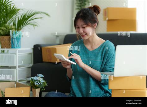 Asian Small Business Owner Working At Home Office Business Retail