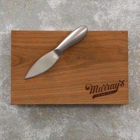 A Knife On Top Of A Wooden Cutting Board With The Word Murray S Written