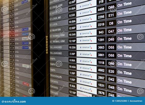 Airlines Flight Arrival And Departures Information Monitors At Miami