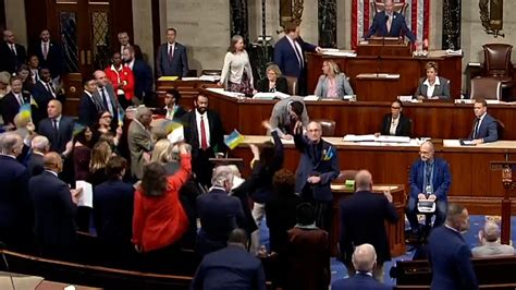 Representatives Celebrate And Wave Flags After Congress Passes Ukraine