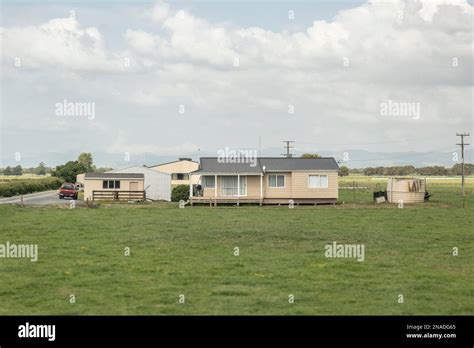 Typical farm house on a rural farmland in New Zealand Stock Photo - Alamy