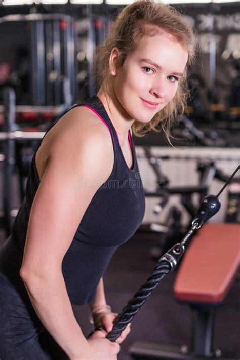 Athletic Blonde Woman In Sportswear Doing Exercise On The Triceps On