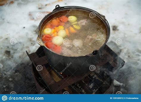 The Soup Is Cooked In A Large Pot Over A Fire Stock Photo Image Of