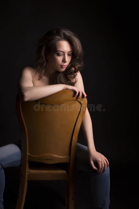 Beautiful Naked Woman With Lush Hair In The Shadows Stock Photo Image