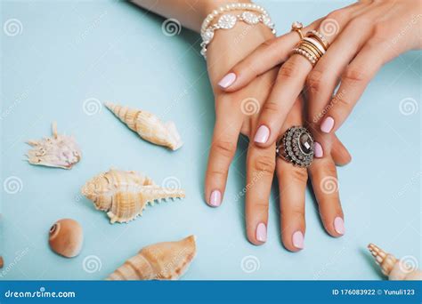 Beautiful Woman Hands With Pink Manicure Holding Plate With Pearls And