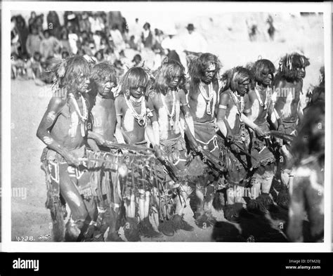 Snake Priests Chanting Songs And Swinging Eagle Feathers During A Snake