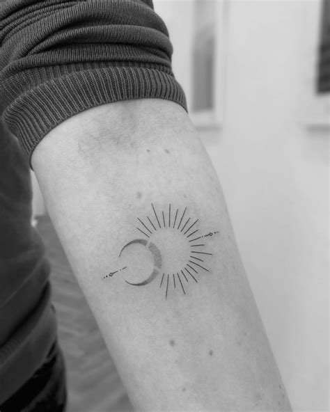 Fine Line Sun And Moon Tattoo On The Inner Forearm