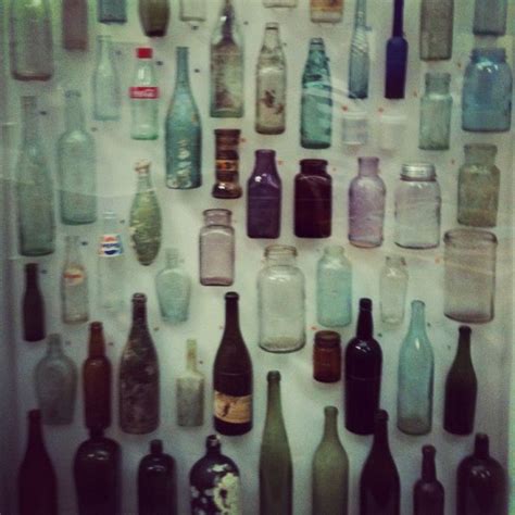 Glass Bottles Taken With Instagram A Collection Of Vintage Glass Bottles In A Cabinet At The