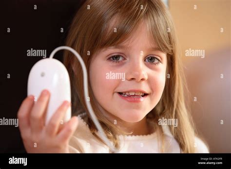 Child Holding Up Computer Mouse Stock Photo Alamy