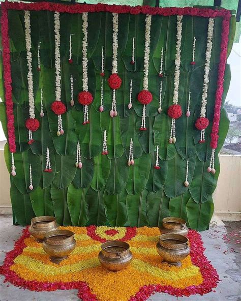 An Arrangement Of Flowers And Metal Bowls On Display