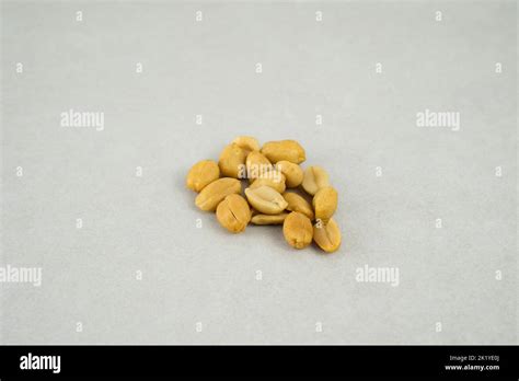 A Handful Of Peanuts Isolated On A Grey Background Stock Photo Alamy