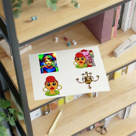 Some Stickers Are Sitting On Top Of A Book Shelf Next To A Potted Plant