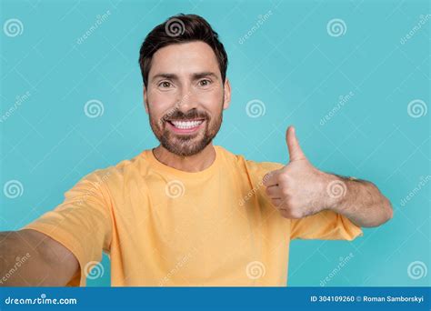 Selfie Of Young Attractive Man Wear Yellow T Shirt Demonstrate His