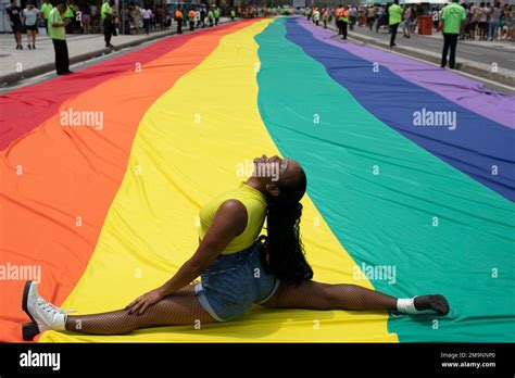 A Woman Poses For A Photo During The Th Gay Pride Parade Along