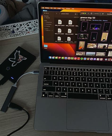 An Open Laptop Computer Sitting On Top Of A Wooden Desk