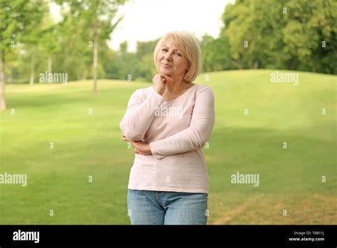 Portrait Of Beautiful Mature Woman Outdoors Stock Photo Alamy