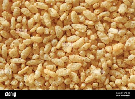 Grains of puffed rice cereal, filling the frame Stock Photo - Alamy