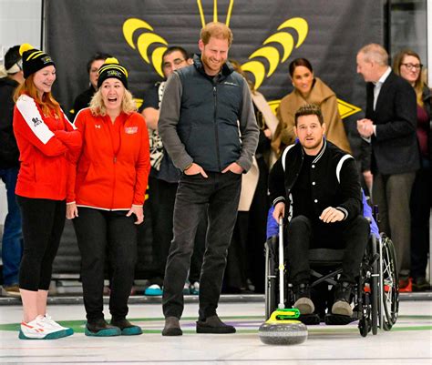 Prince Harry Tries Curling With Michael Buble In Canada