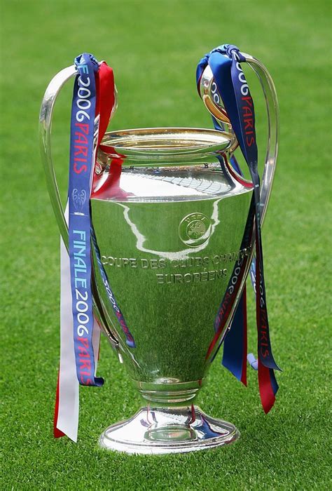 The uefa champions league trophy is placed on the pitch for – Artofit