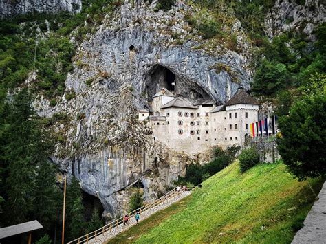 Castle built into a cave. Predjama Castle, Slovenia : r/pics