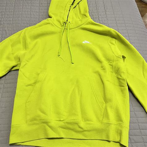 Neon green Nike hoodie, one of the laces is a bit... - Depop