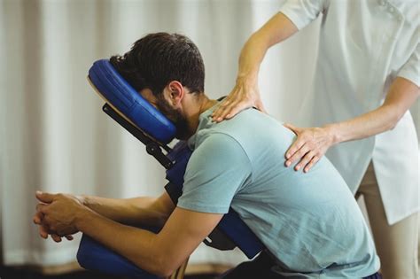 Premium Photo Physiotherapist Giving Back Massage To A Patient