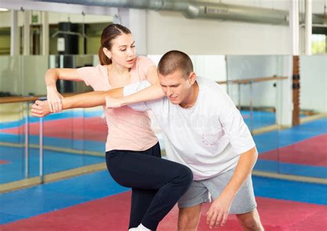 Woman Performing Knee Strike during Self-defence Training Stock Photo ...