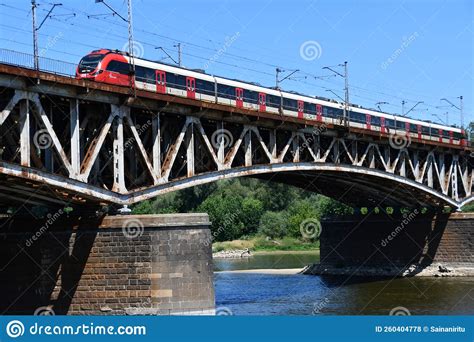 Tram Running Across The Swietokrzyski Bridge Over The Vistula River In