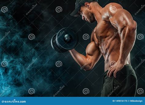 Muscular Fitness Sports Man Atlete With Dumbbell In Fitness Gym Stock