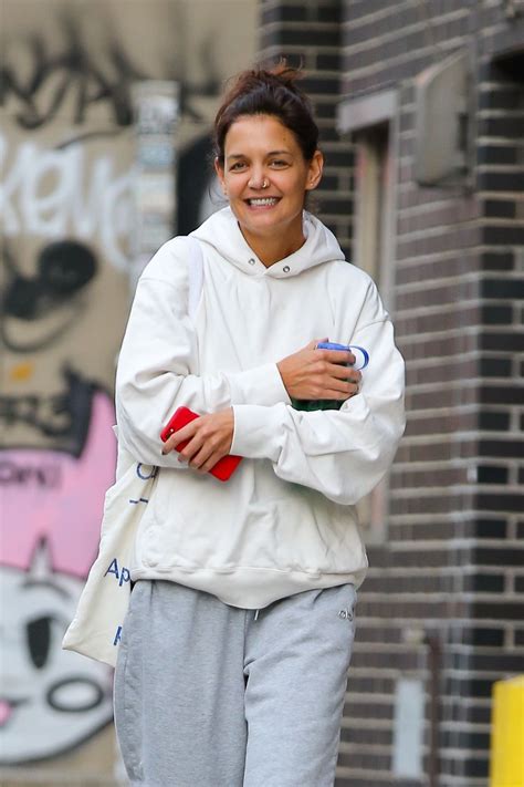 Katie Holmes In Grey Sweatpants A White Sweater And A Pair Of Colorful