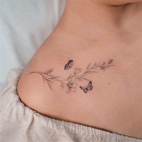 Flowers And Butterflies Tattoo Located On The