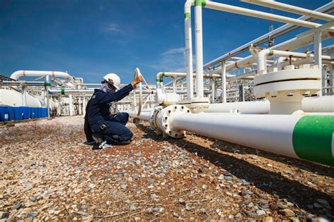 Premium Photo Production Operator Opening Ball Valve At Pipeline Oil